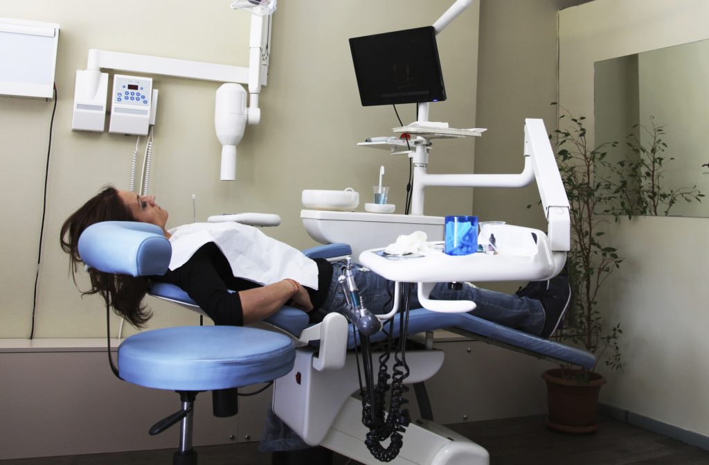 Woman in dental chair at dentist