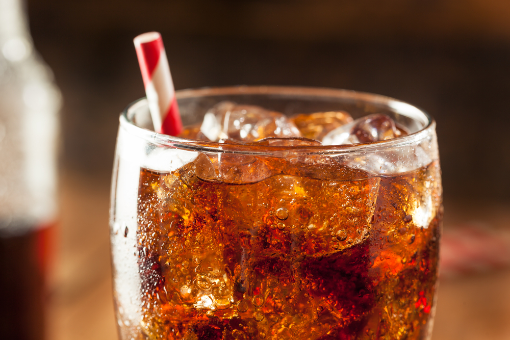 Soda in glass with straw