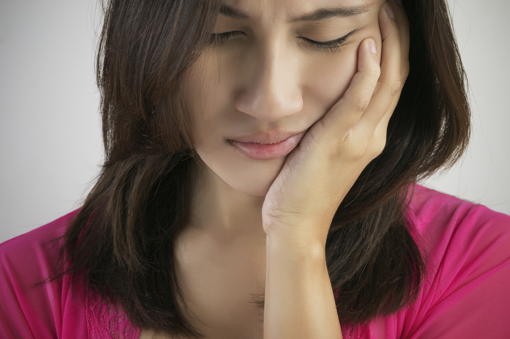 Woman feels a toothache